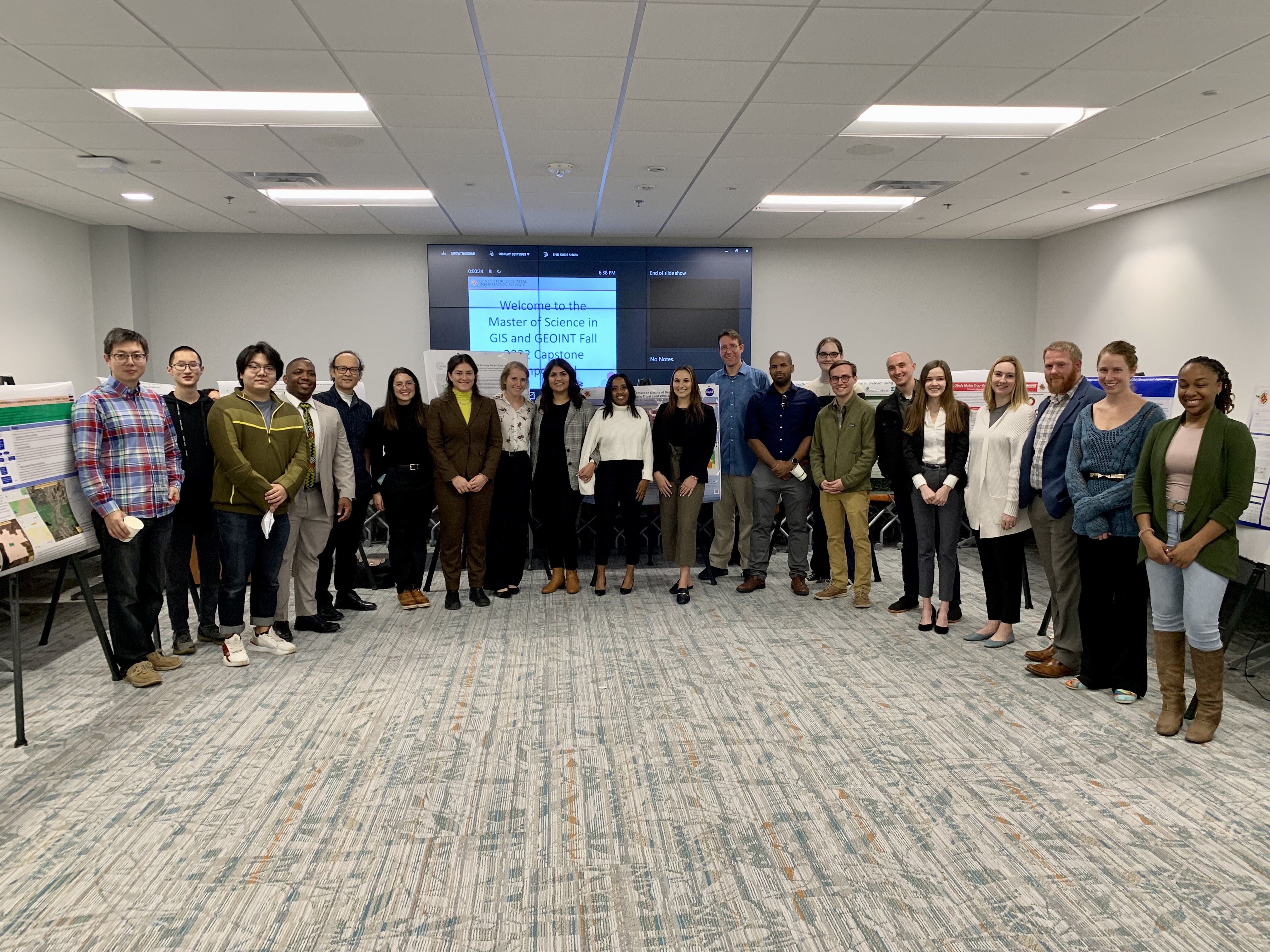 MS students and faculty lined up for a group photo at the poster symposium
