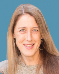 Headshot of Louise Chini against blue background